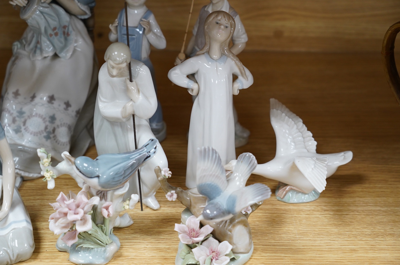 Twelve various Lladro figures including birds and kittens, tallest 33cm. Condition - good